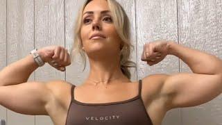 Beautiful muscular woman flexing muscles