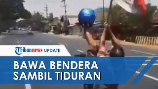 VIRAL Video Pria di Pasuruan Kendarai Motor Sambil Tiduran dan Bawa Bendera, Kini Diburu Polisi