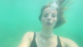 Many underwater bubbles in the sea and a lot of lying on the back