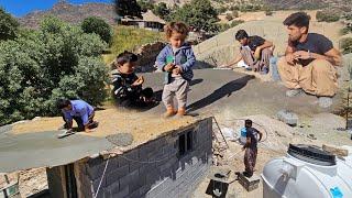 Rural life: pouring concrete on the roof of the house with the help of Ali and Sajad's family