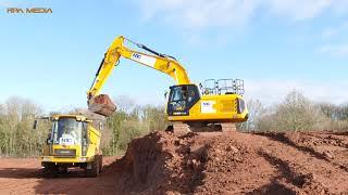 NEW JCB 220X of NB Construction loading Hydrema dump trucks with soil.