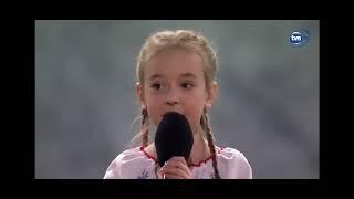 7yo girl from Kiev shelter sings Ukraine anthem on big stage in Poland. Broadcasted to 50 countries.