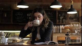 Woman drinking coffee in a cafe