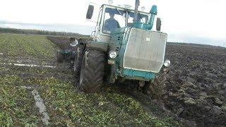 Difficult ploughing with T-150K, mud, wet conditions