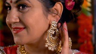 Beautiful Indian housewife / woman wearing earrings / jhumka f... | Indian Stock Footage | Knot9