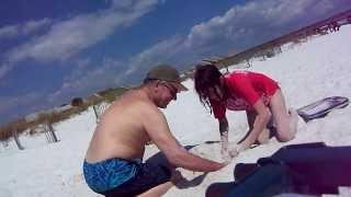 KID BURIED IN SAND SCREAMS WHEN HIS FEET ARE TICKLED