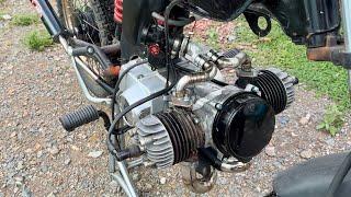 I use two lawnmower motors and make a two-stroke boxer motor.