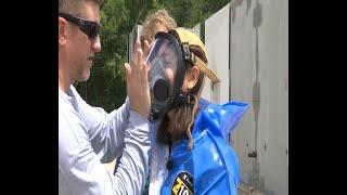 WEB EXTRA: What it takes to get into a Level B hazmat suit