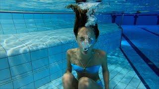 Carla Underwater blowing bubbles underwater