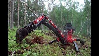 ATV backhoe removing stumps and topsoil