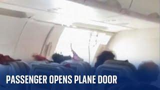 Passenger opens plane door mid-flight