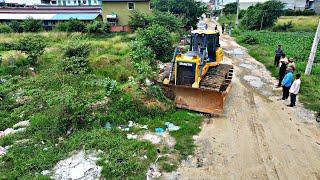 WONDERFUL.OPERATED OF FILLING FLOODED LAND NEXT TO THE ROADS USE SHANTUI DOZER AND SMALL DUMP TRUCKS