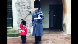 Boy Dressed as British Guard Salutes Windsor Castle Soldiers