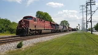 CPKC 247 with gray ghost and CP SD40-2 trailing and large ballast cut meets 148 at Morton Grove