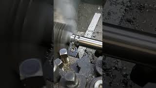 Manual machining parting tool on lathe