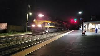 KCS 4009 'Saluting KCS Heroes' leads CPKC 255 through Morton Grove