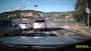 Dump Truck crashes into car and plows through intersection