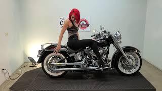 Elli shows off a 2009 Deluxe Softail Gangsta