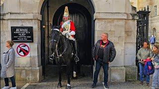 THAT LOOK! ARROGANT TOURIST SEEMS TO THINK THE RULES DON'T APPLY TO HIM at Horse Guards!