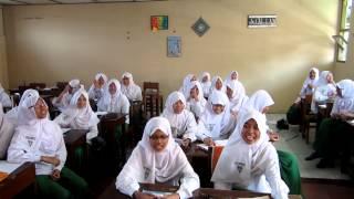 Students at the Mualimlaat Girl's School Sing the Indonesian National Anthem