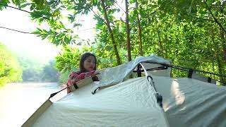 Camping deep in the forest, relaxing with stunning mountain scenery on a sunny day