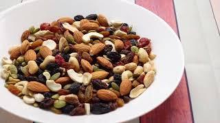 Close Up of Many Mixed Nuts on Plate Free Stock Videos without watermark