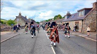 Thundering drums as the massed bands play Scotland the Brave on march back into Dufftown in Scotland