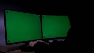 hacker using computer green screen with tracking marker