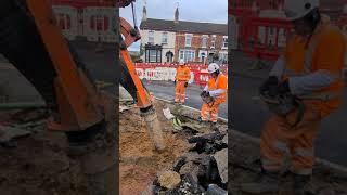 Vac UK, digging around the footway utility cables to expose the pipes safely and efficiently.