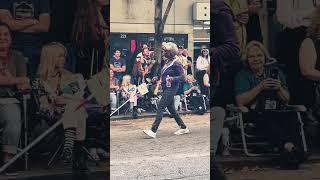 Deadpool’s roommate, Blind Al, strutting through the DragonCon 2024 Parade in Downtown Atlanta