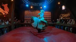 Bikini mechanical bull riding in Las Vegas: A cowgirl goes for 1st place on a frisky bull