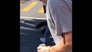 Dude rolling off from a skateboard