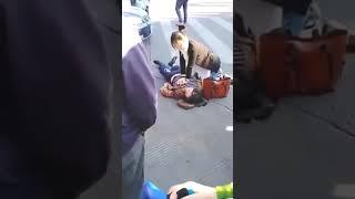 CPR on woman in the street