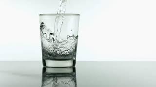 Water pouring into glass slow motion' royalty free HD stock video footage