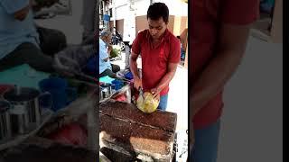 Chopping open a coconut (slo-mo) in Lucky Garden, Kuala Lumpur