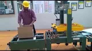 SIGNODE MAKE CARTON TAPING MACHINE WITH AUTOMATIC BOTTOM FLAP CLOSED (FTM550)