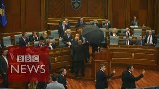 Kosovo: PM Isa Mustafa pelted with eggs in parliament - BBC News