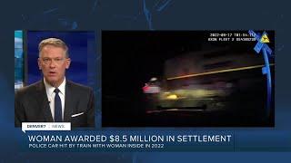 Woman in police car hit by train awarded $8.5 million in lawsuit settlement