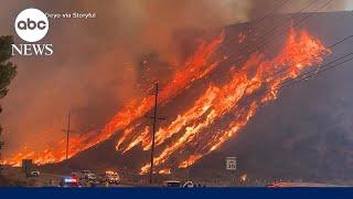 New wildfire explodes in Southern California