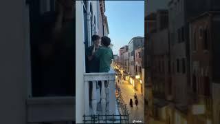 gay couple in  balcony romance