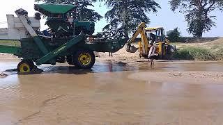 John Deere tractor stuck in river rescued by jcb