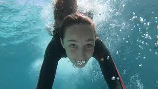 Carla underwater swimming with a wetsuit