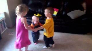 Kids playing 'Ring-Around-the-Rosy'