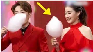 Chinese TV presenter shoves entire candy floss into her mouth in 3 seconds.