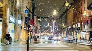 Snowy Saturday in Stockholm. Walking under the Christmas lights to the Nobel Banquet. City ambiance.