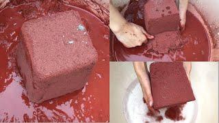 Soft red sand cement buckets crumbling in water