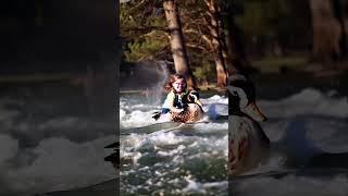 Cute baby || little girl wearing glasses riding a duck in a fierce pond.