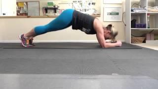 Dolphin plank exercise from the 21 Day Fix Extreme workout program.
