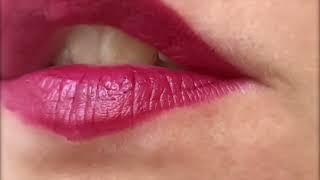 Extreme close up of woman's red lips eating a pear. ASMR with sound.