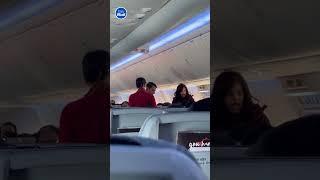 Passenger screams at flight attendants to move 'dirty man'